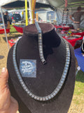 A black and clear bigets necklace and bracelet